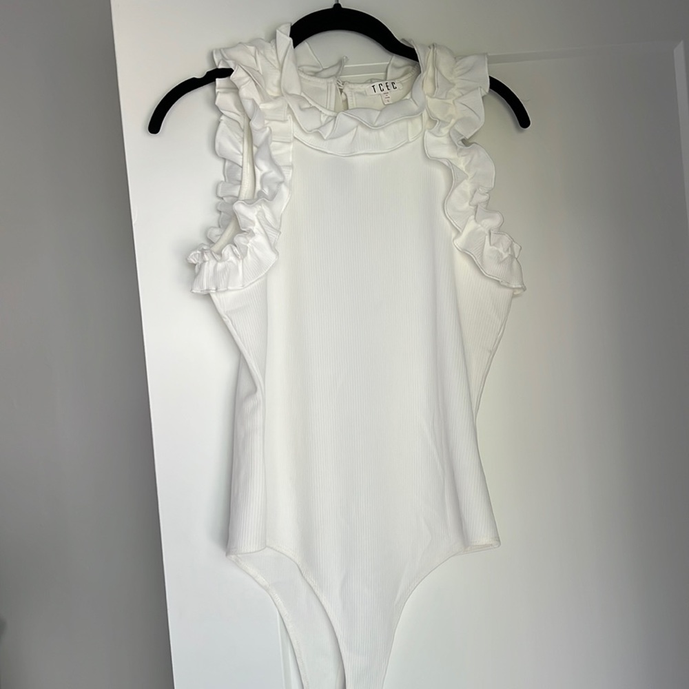 Ruffle body suit (never worn)